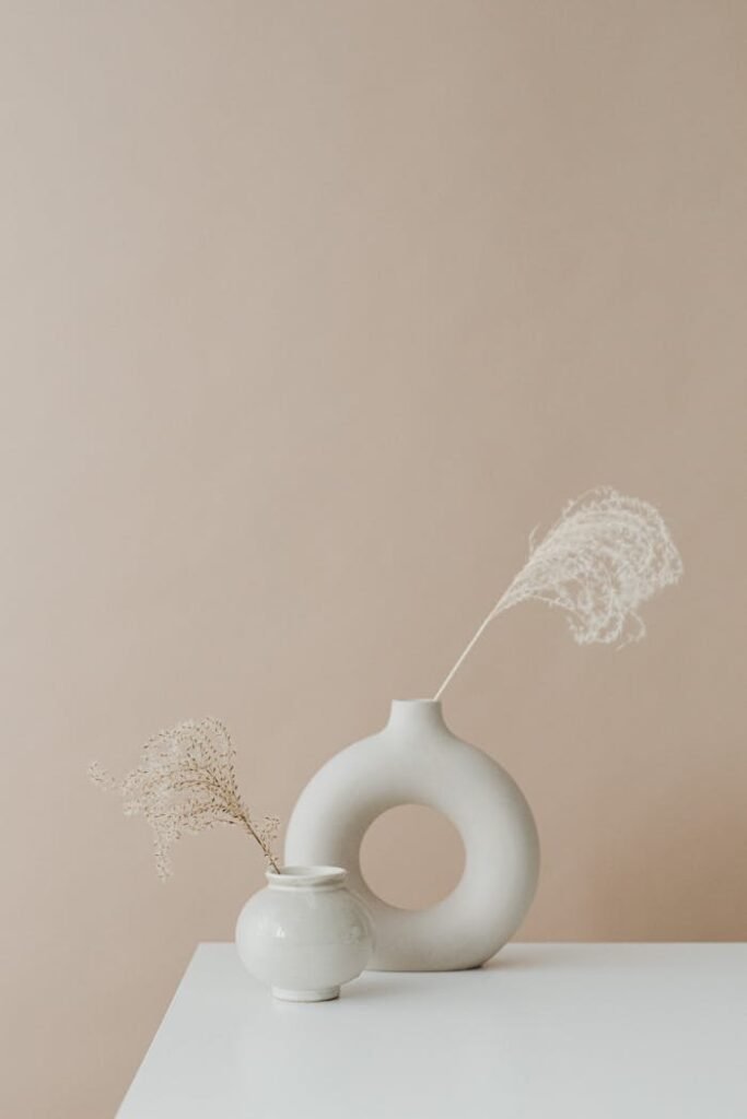 Stylish minimalist decor featuring modern vases on a neutral background.